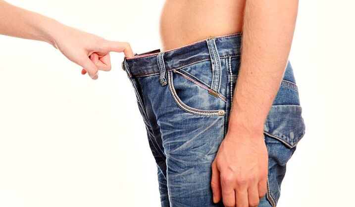 woman peeking into the pants of a man with an enlarged penis soda